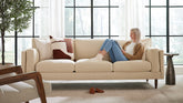 BenchMade Modern Skinny Fat Tan Upholstered Sofa with Woman Reading