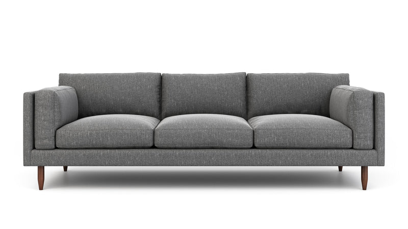 Gray mid-century sofa with wooden legs, matching cushions, and clean lines.